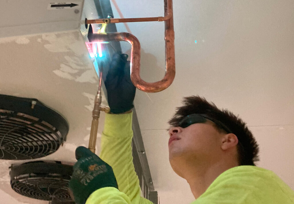 Man Welding pipes
